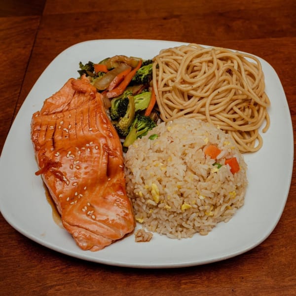 Oishii Hibachi Grill's salmon hibachi dinner with fried rice, noodles, and mixed vegetables.